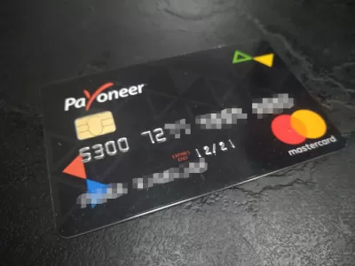 Payoneer Review: Receive Payments From Dollars To Euros : A black Payoneer mastercard for international USD payments to convert to EUR